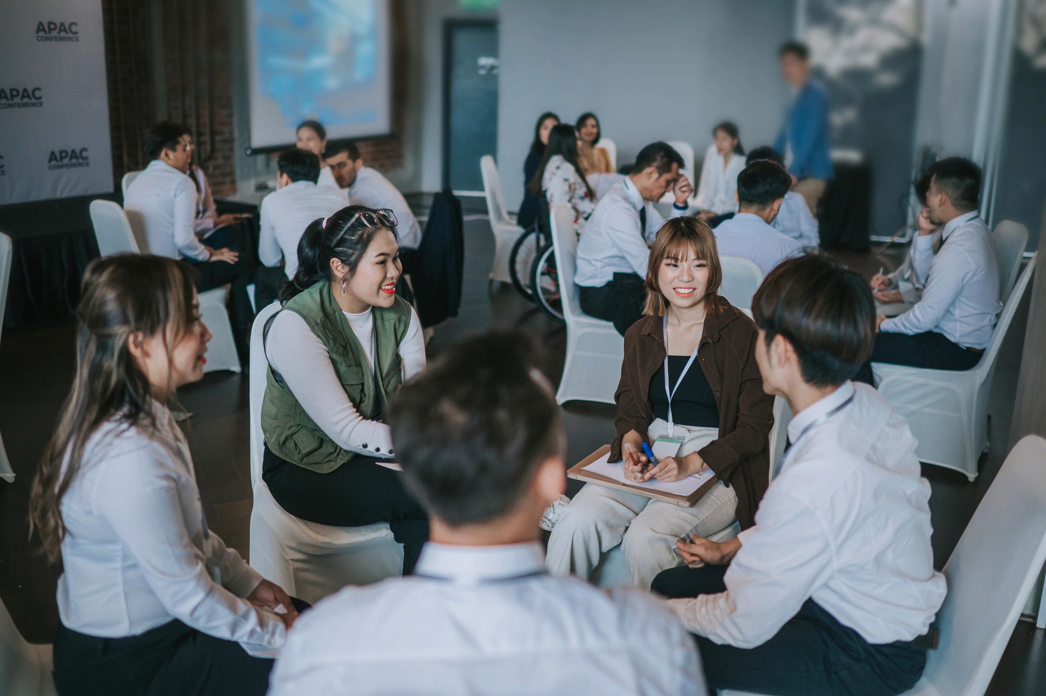 Business workshop participants collaborating in a training session
