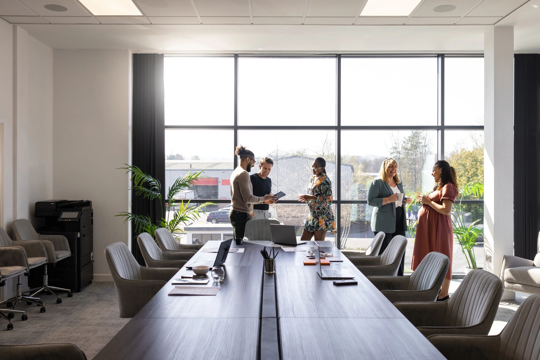 Business colleagues discussing ideas during a workshop presentation